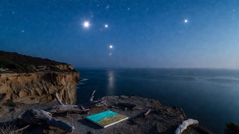 Starlit Victorian cliff at night with small canvas showing emerging blended colours over scars, balanced driftwood sculptures, calm Bass Strait, representing CPTSD post-traumatic growth, resilience, new meaning, and hope in trauma recovery.